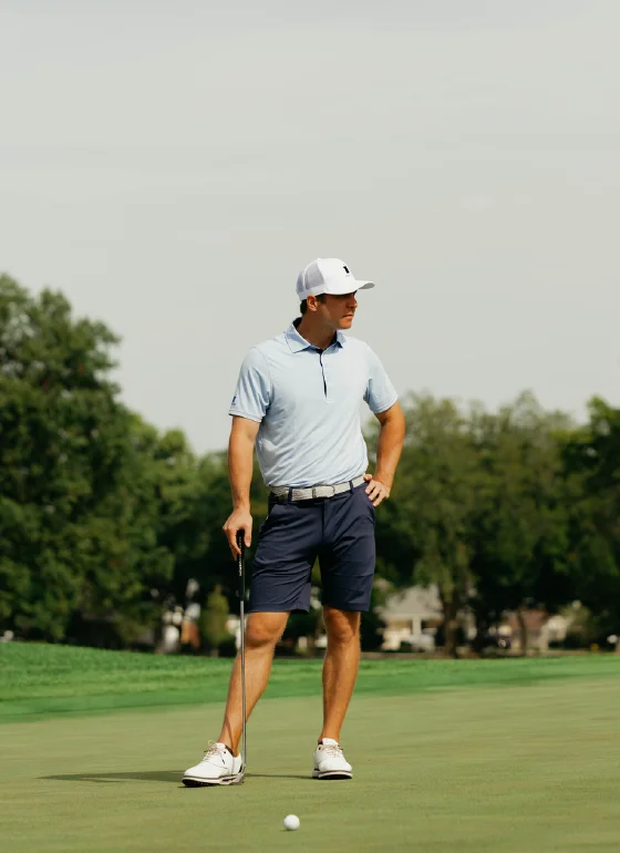 Golfer in Castle Golf Co. polo on the green